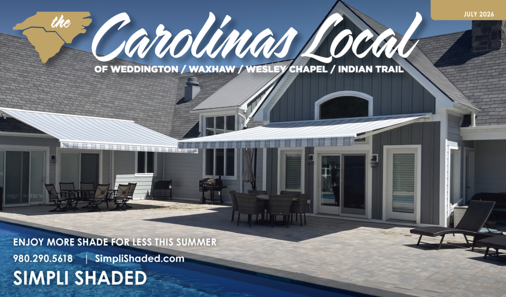 Modern house with two blue-striped retractable awnings over a patio and pool, outdoor furniture, and text promoting Simpli Shaded—a trusted SunPro dealer—featured on the cover of The Carolinas Local magazine, July 2026 edition.